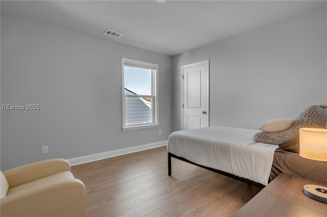 bedroom featuring dark hardwood / wood-style flooring