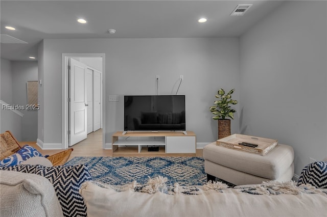 living room with light hardwood / wood-style flooring