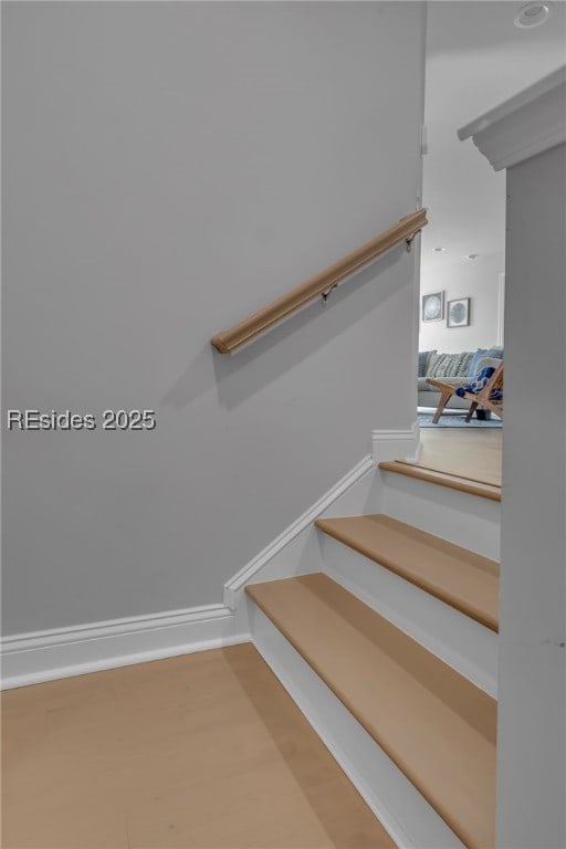 staircase featuring hardwood / wood-style floors