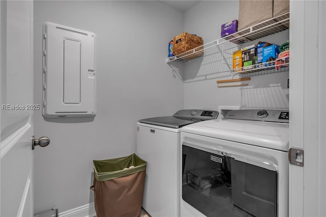 washroom featuring washing machine and dryer