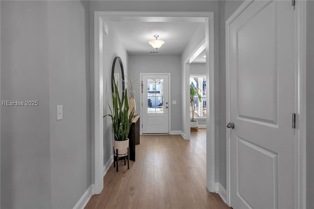 foyer with light hardwood / wood-style floors