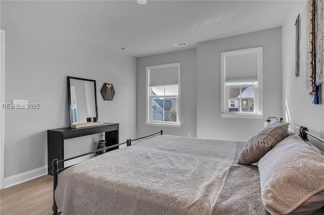 bedroom featuring light hardwood / wood-style floors