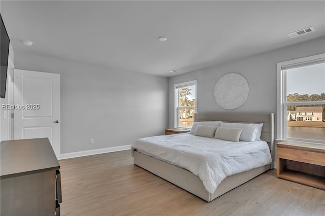 bedroom with light wood-type flooring