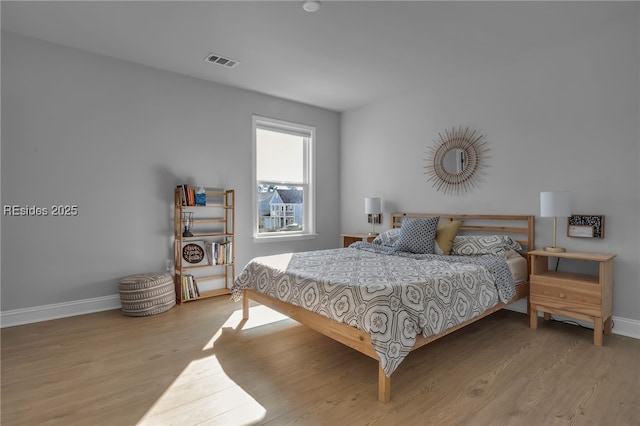 bedroom featuring light hardwood / wood-style flooring