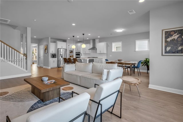 living room with light hardwood / wood-style flooring