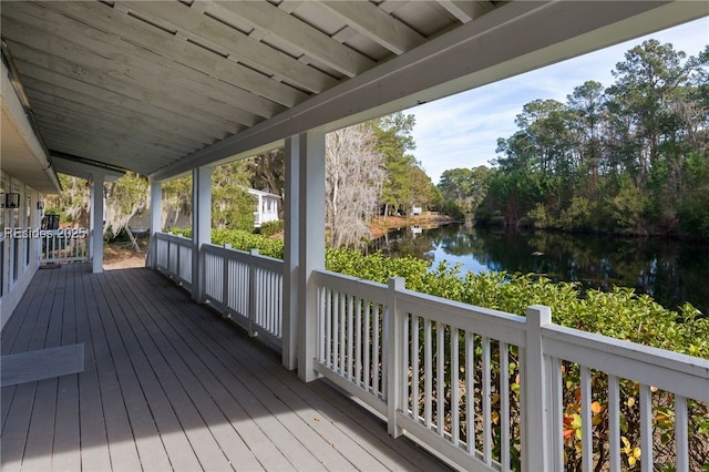 wooden deck with a water view