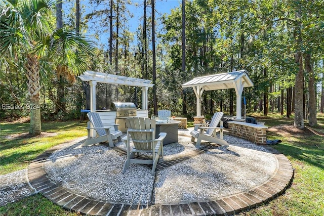 view of patio / terrace with area for grilling, grilling area, and an outdoor fire pit