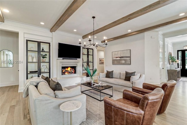 living room with beamed ceiling and light hardwood / wood-style floors