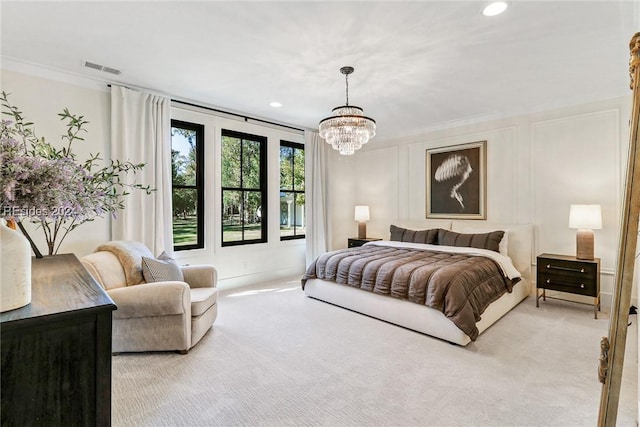 carpeted bedroom featuring ornamental molding and a chandelier