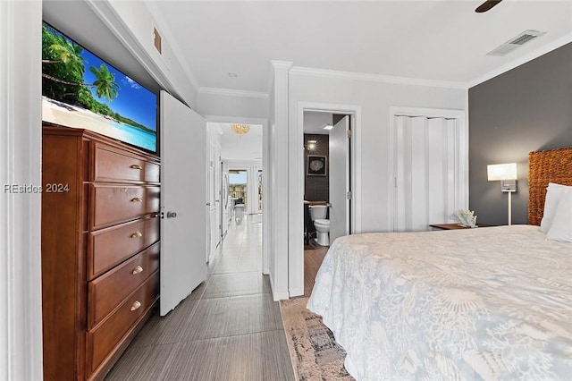 bedroom with crown molding, a closet, ceiling fan, and ensuite bathroom