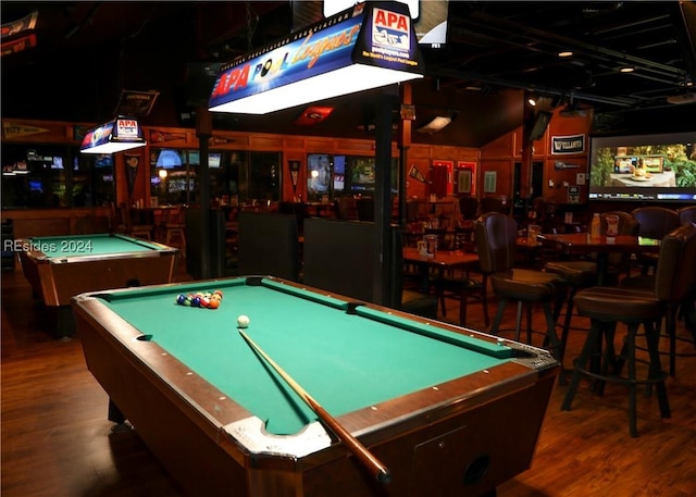 recreation room with bar, pool table, dark wood-type flooring, and lofted ceiling