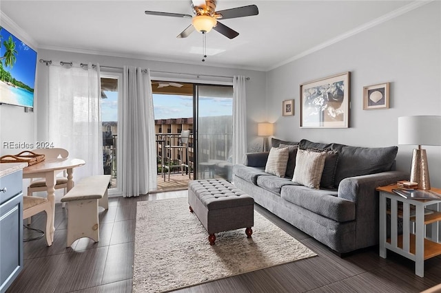 living room featuring ornamental molding and ceiling fan