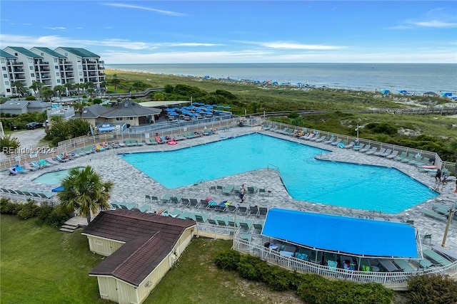 view of swimming pool featuring a water view