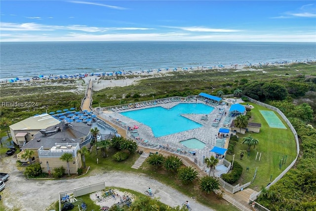 aerial view with a water view and a view of the beach