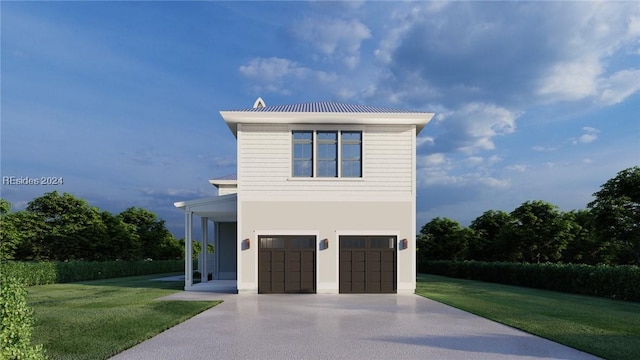 view of front of home featuring a garage and a front lawn