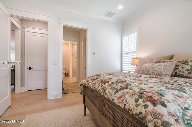 bedroom featuring light hardwood / wood-style floors