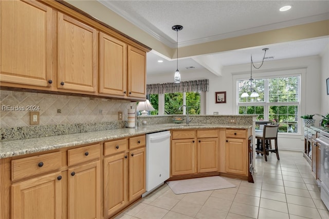 kitchen with sink, hanging light fixtures, white appliances, light stone countertops, and decorative backsplash