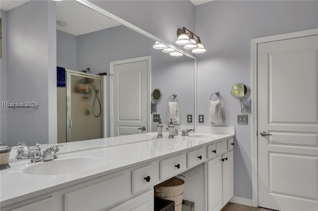 bathroom with vanity and an enclosed shower