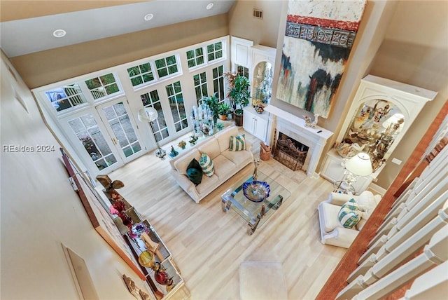 living room featuring high vaulted ceiling