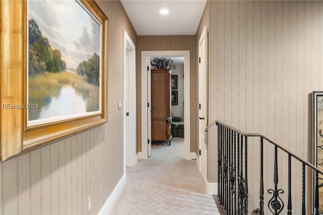 corridor with light colored carpet