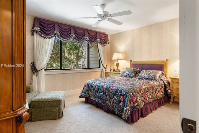 carpeted bedroom featuring ceiling fan