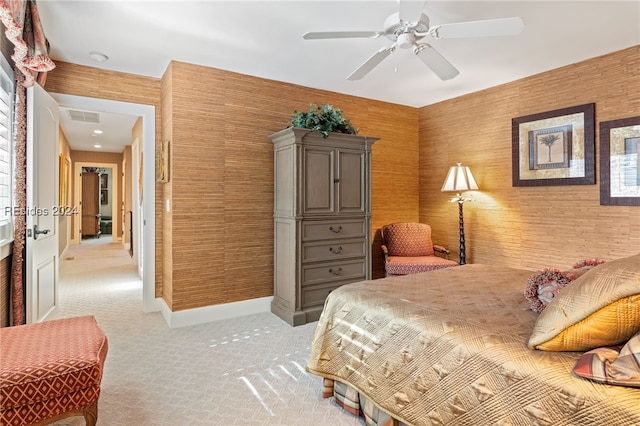 bedroom with light colored carpet and ceiling fan