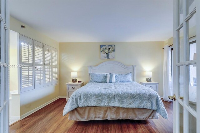 bedroom featuring wood-type flooring