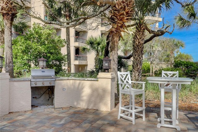 view of patio featuring a grill and exterior kitchen