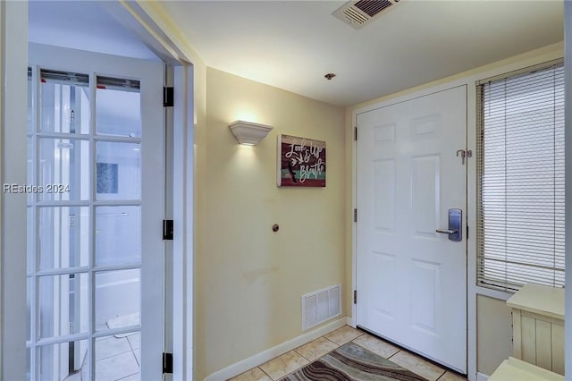 view of tiled foyer entrance