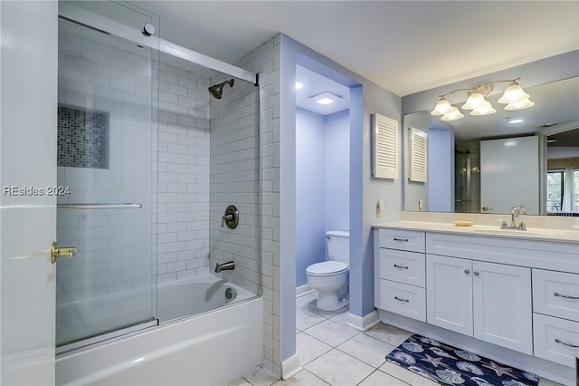 full bathroom with vanity, tile patterned floors, shower / bath combination with glass door, and toilet