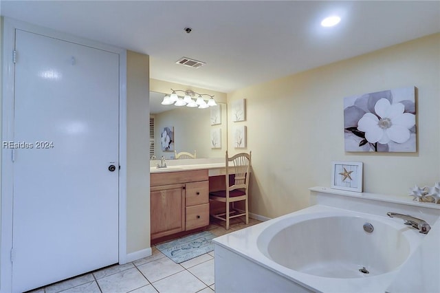 bathroom with tile patterned floors, vanity, and a bath