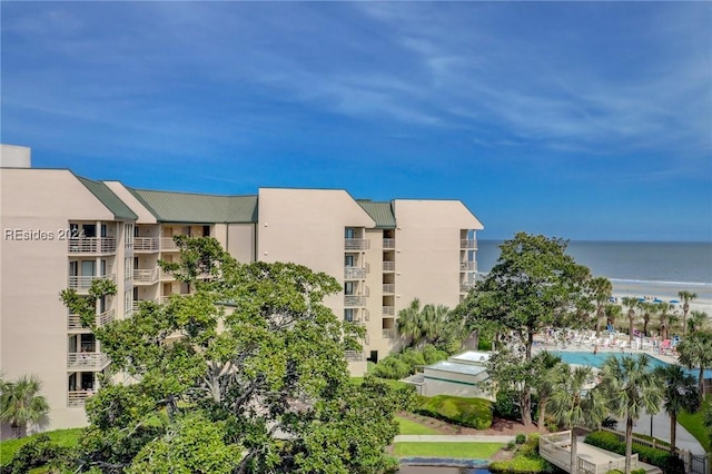 view of building exterior with a water view