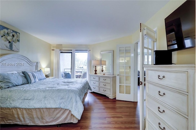 bedroom with dark hardwood / wood-style floors