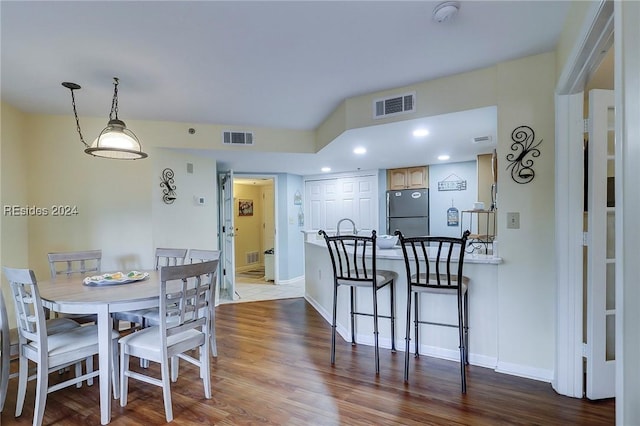 dining area with wood-type flooring