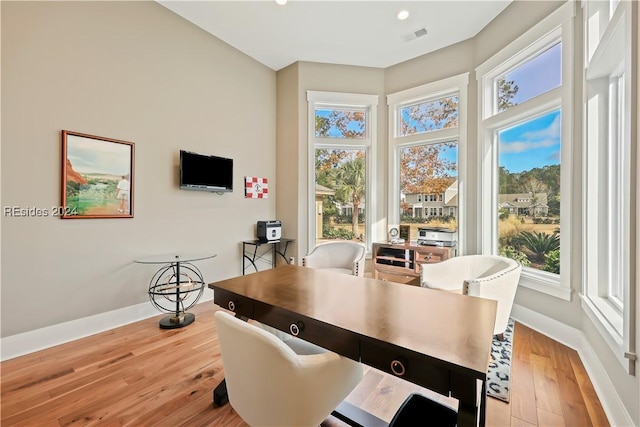 dining area with light hardwood / wood-style floors