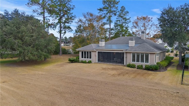 view of front of property with a sunroom