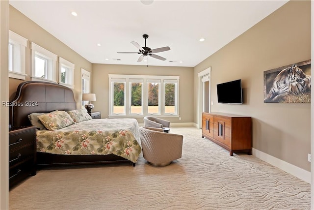 bedroom featuring light carpet and ceiling fan