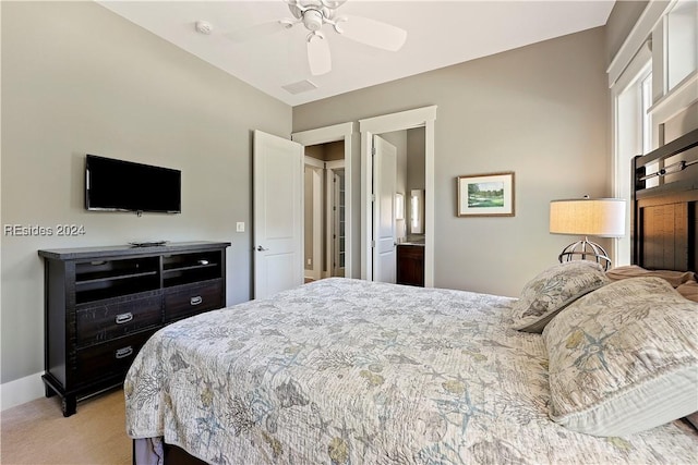 bedroom with light colored carpet and ceiling fan