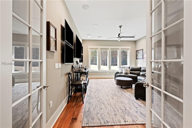 interior space featuring hardwood / wood-style flooring, french doors, and ceiling fan