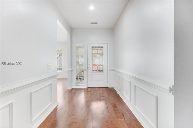 doorway to outside with light hardwood / wood-style flooring