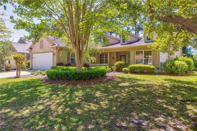 view of front of home with a garage and a front yard