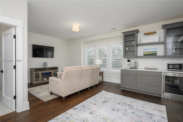 living room featuring dark hardwood / wood-style floors and wine cooler