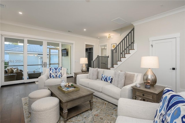 living room with crown molding and hardwood / wood-style flooring