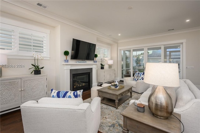 living room with hardwood / wood-style flooring and ornamental molding