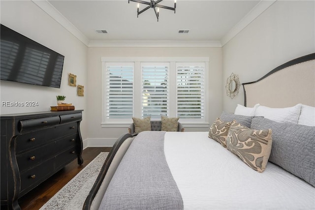 bedroom featuring crown molding, a chandelier, and dark hardwood / wood-style flooring