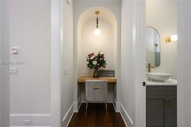 hall with dark hardwood / wood-style flooring and sink