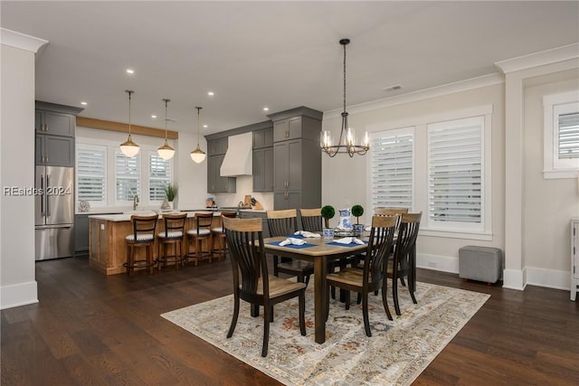 dining area with dark hardwood / wood-style flooring, a notable chandelier, and a wealth of natural light