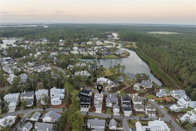 aerial view at dusk with a water view