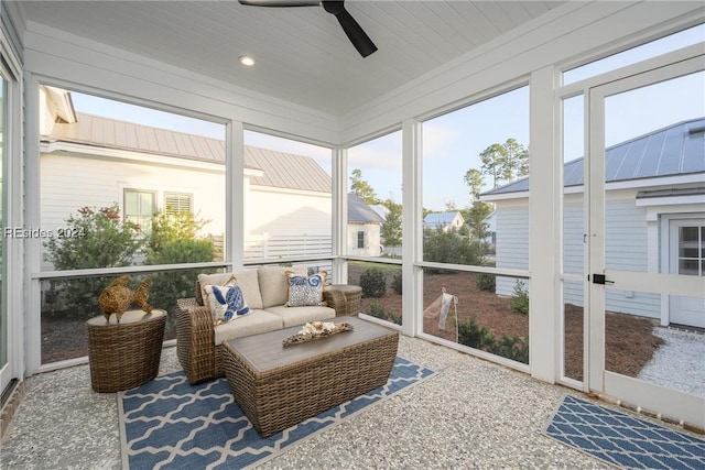 sunroom / solarium with wood ceiling and ceiling fan