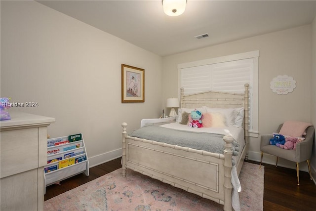 bedroom featuring dark hardwood / wood-style flooring